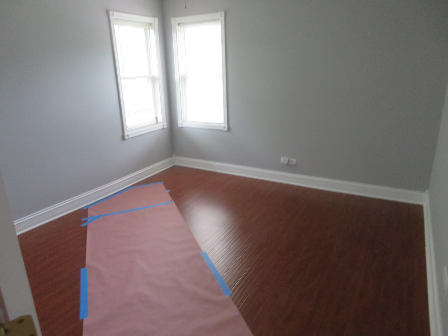 6834 West Lode Drive, Unit 3A Worth, IL 60482 - Photo 7 of 11 an empty room with wooden floor and windows