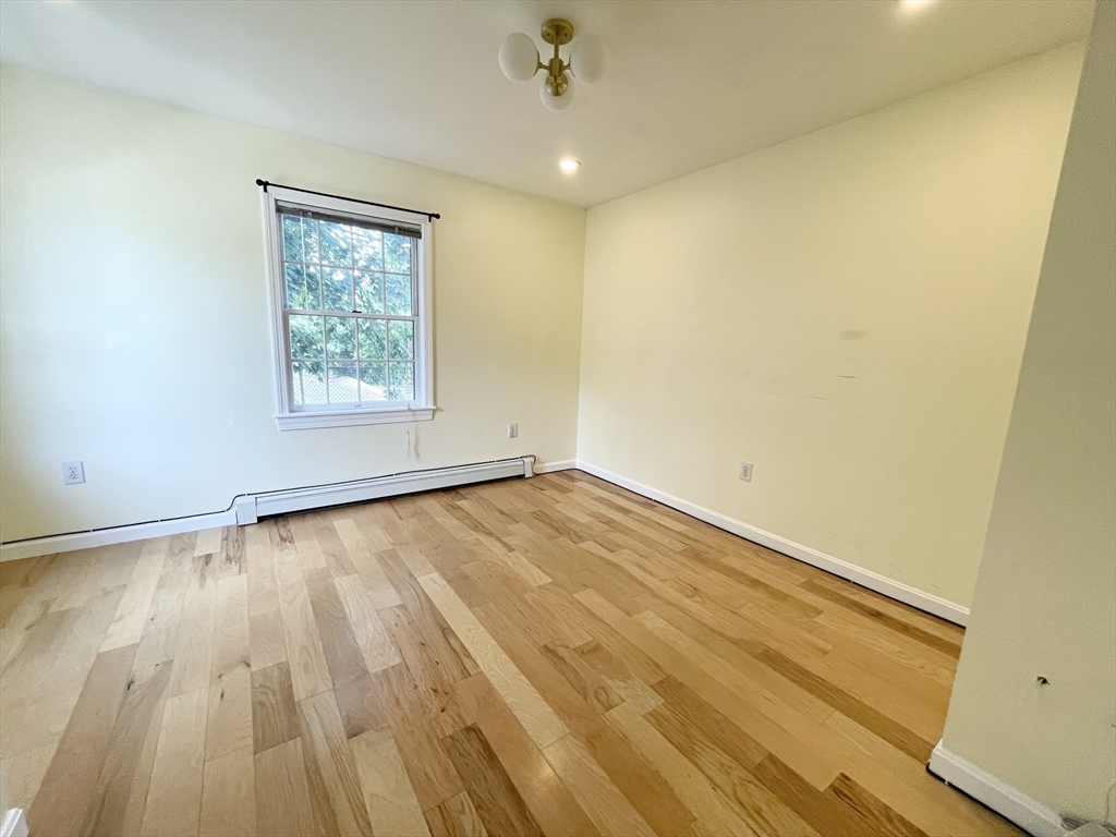 2 Holden Street, Unit 2 Boston, MA 02125 - Photo 9 of 12 wooden floor in an empty room