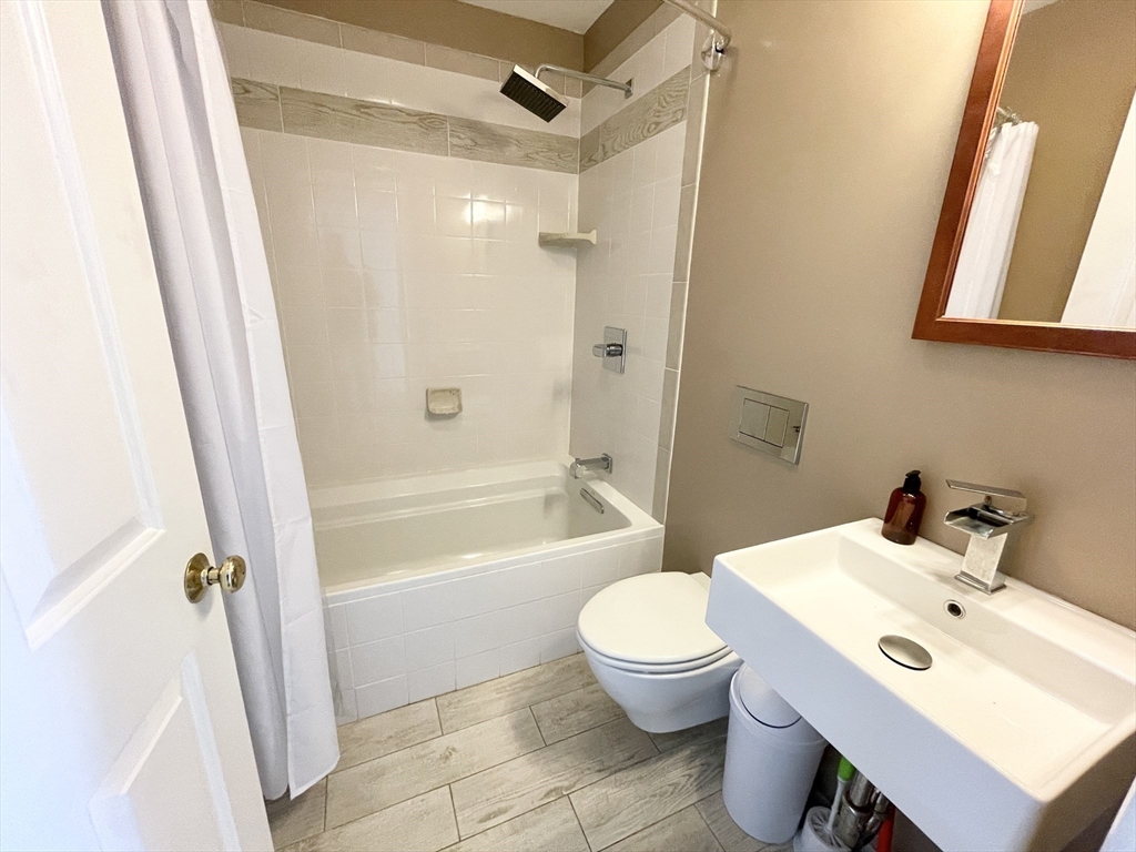 2 Holden Street, Unit 2 Boston, MA 02125 - Photo 10 of 12 a bathroom with a sink toilet and shower