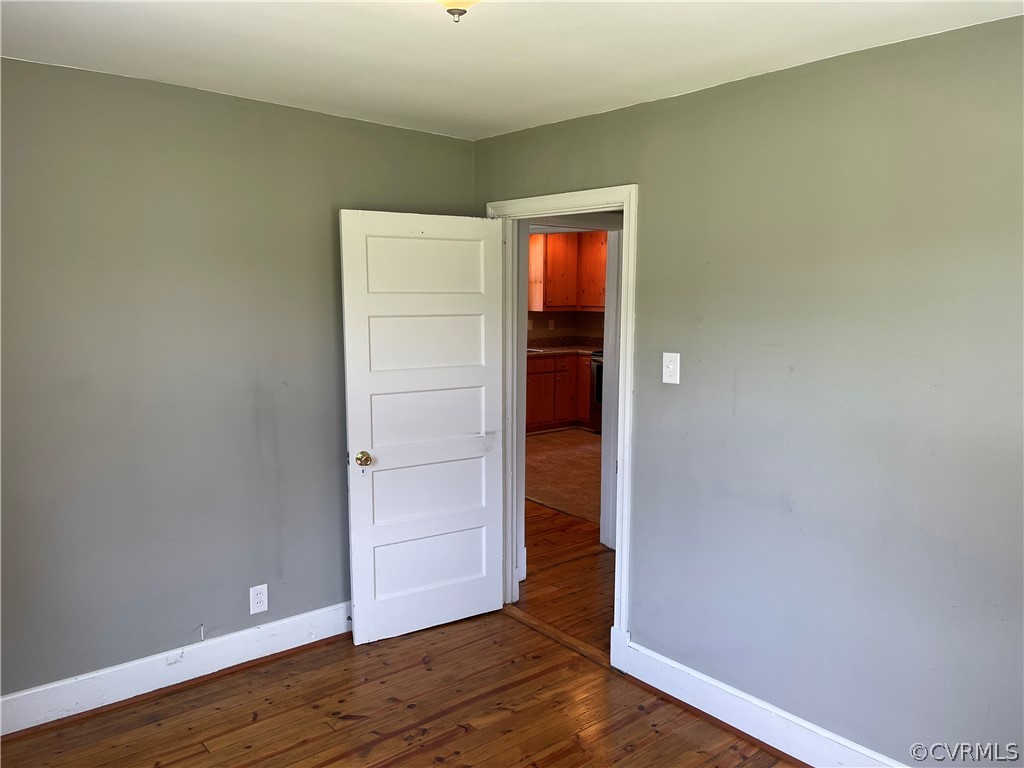 8243 Varina Road Henrico, VA 23231 - Photo 16 of 23 a view of an empty room and wooden floor