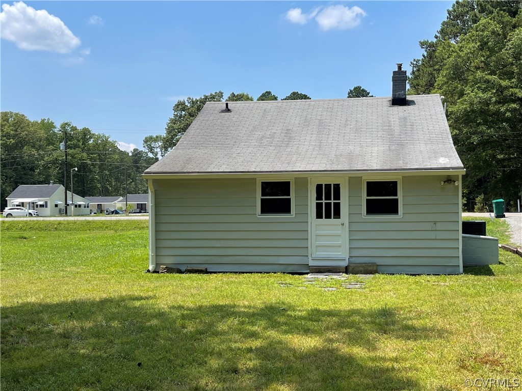 8243 Varina Road Henrico, VA 23231 - Photo 21 of 23 a front view of a house with a yard