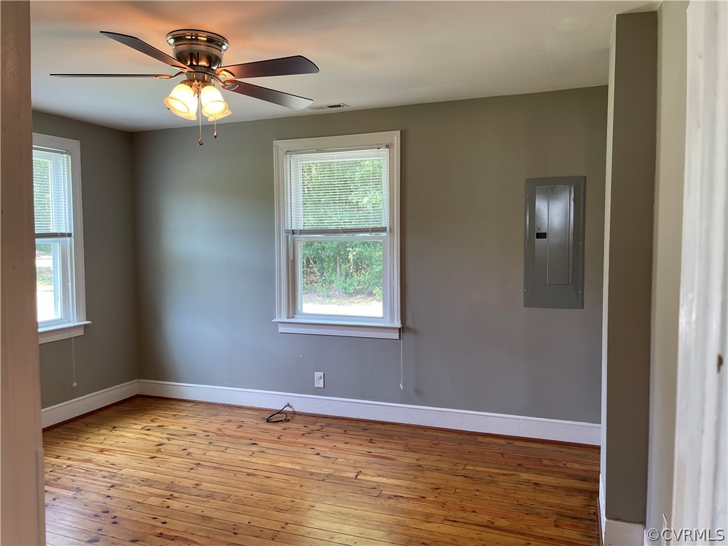 8243 Varina Road Henrico, VA 23231 - Photo 6 of 23 a view of an empty room with window and chandelier fan
