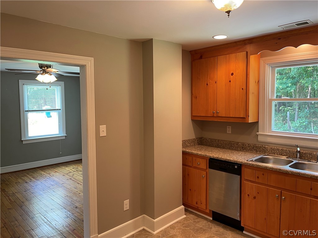 8243 Varina Road Henrico, VA 23231 - Photo 8 of 23 a kitchen with stainless steel appliances granite countertop a sink a stove and a wooden cabinets