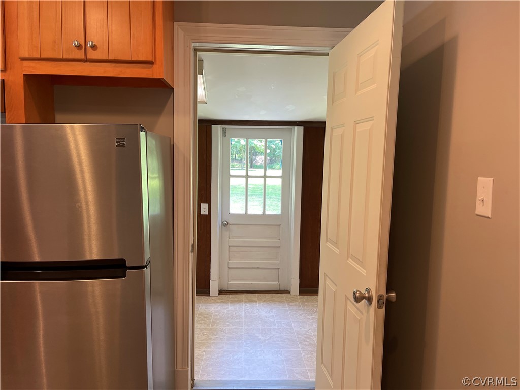 8243 Varina Road Henrico, VA 23231 - Photo 10 of 23 a view of a kitchen with a refrigerator and microwave
