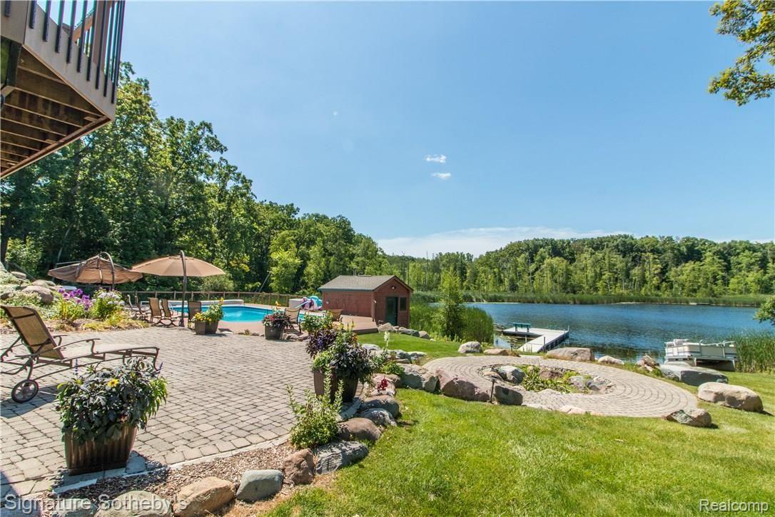 1400 Dockham Road Columbiaville, MI 48421 - Photo 63 of 73 Overlooking Walkout Patio, Pool & Lake