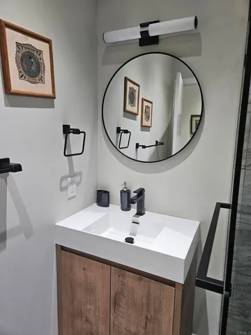 a bathroom with a sink and a mirror