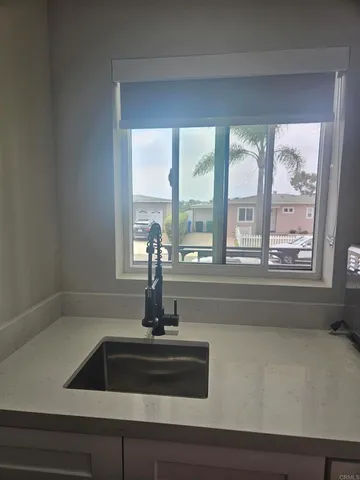 a kitchen with a sink and window