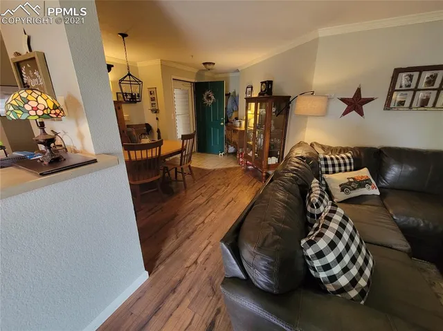 a bedroom with furniture and wooden floor