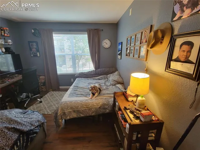 a bedroom with bed and a window