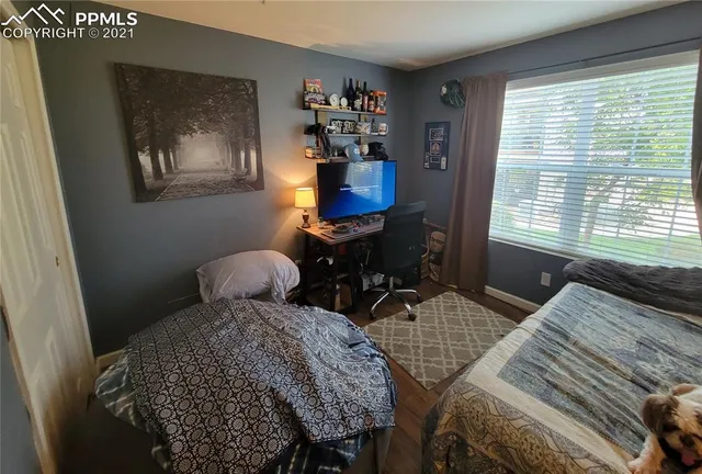 a bathroom with a sink a toilet a mirror and shower curtain