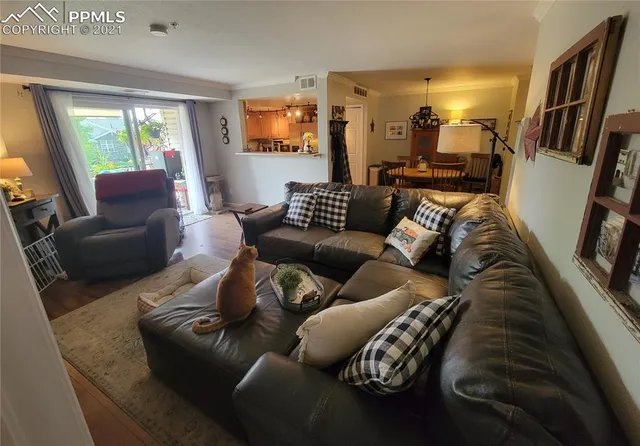 a bedroom with a bed dresser and mirror
