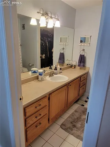 a room with furniture and a floor to ceiling window