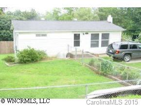 18 Smith Graveyard Road Asheville, NC 28806 - Photo 1 of 4 a view of a backyard with plants and a garden