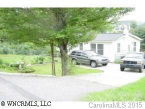 18 Smith Graveyard Road Asheville, NC 28806 - Photo 2 of 4 a view of house with backyard porch and entertaining space