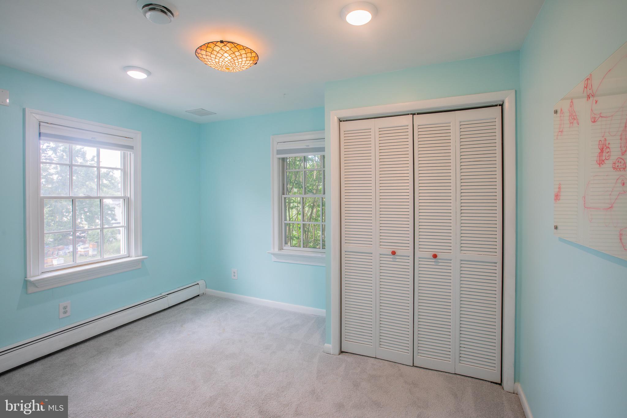 8875 Baltimore Street Savage, MD 20763 - Photo 21 of 32 an empty room with windows and closet