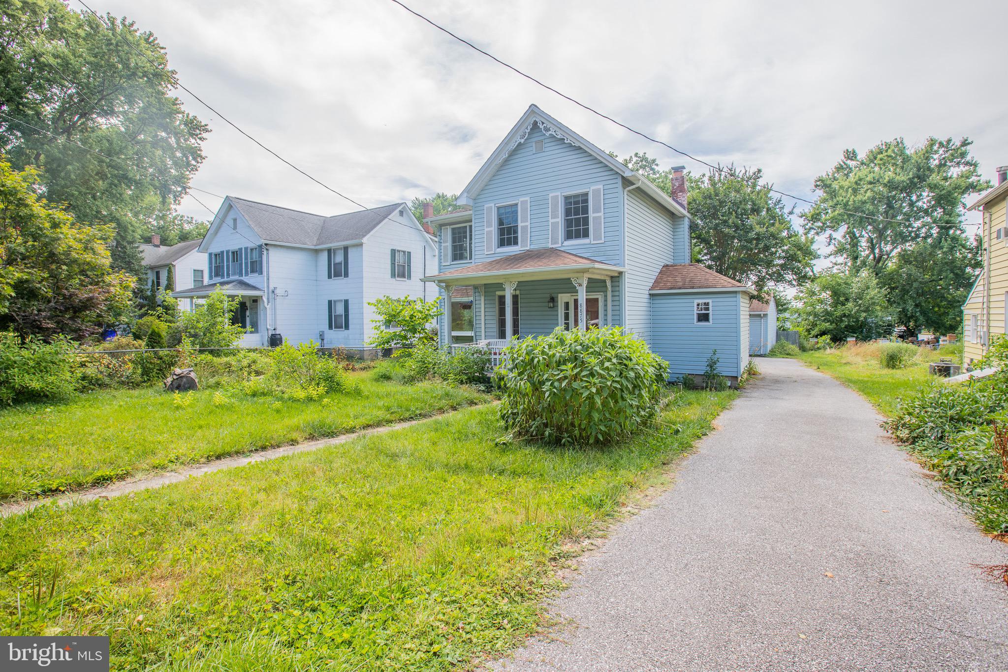 8875 Baltimore Street Savage, MD 20763 - Photo 3 of 32 a front view of a house with garden