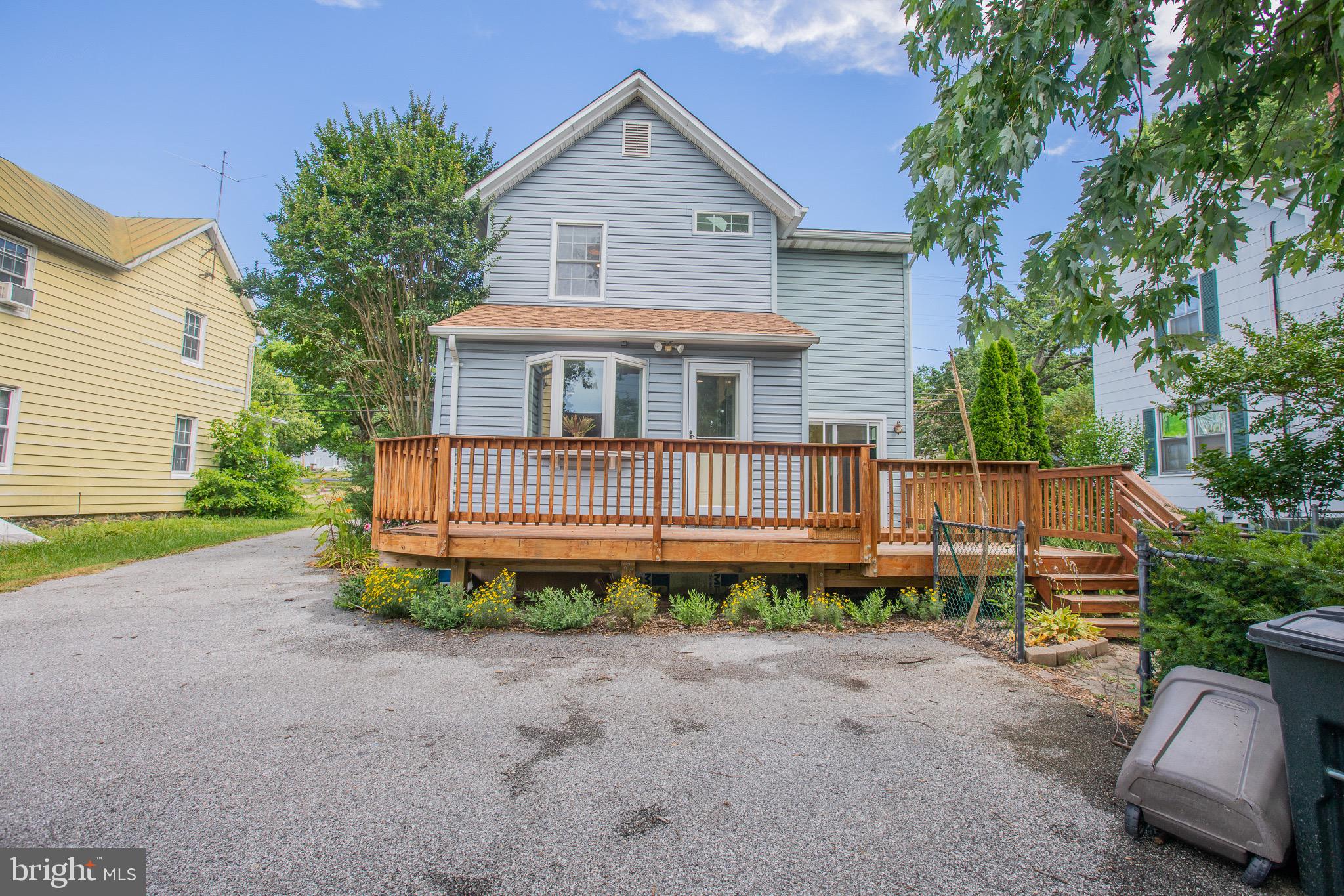 8875 Baltimore Street Savage, MD 20763 - Photo 31 of 32 a view of a house with a yard and potted plants