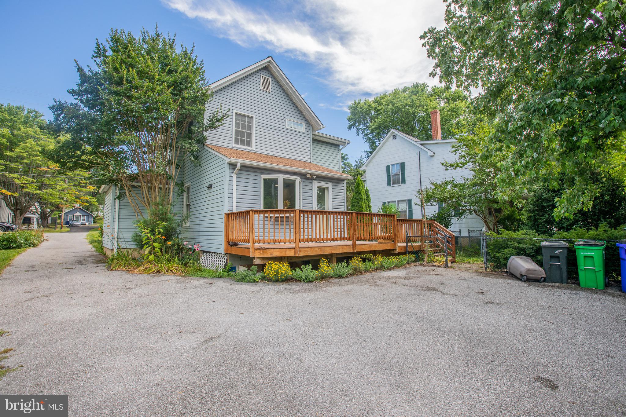 8875 Baltimore Street Savage, MD 20763 - Photo 32 of 32 a front view of a house with a yard and garage