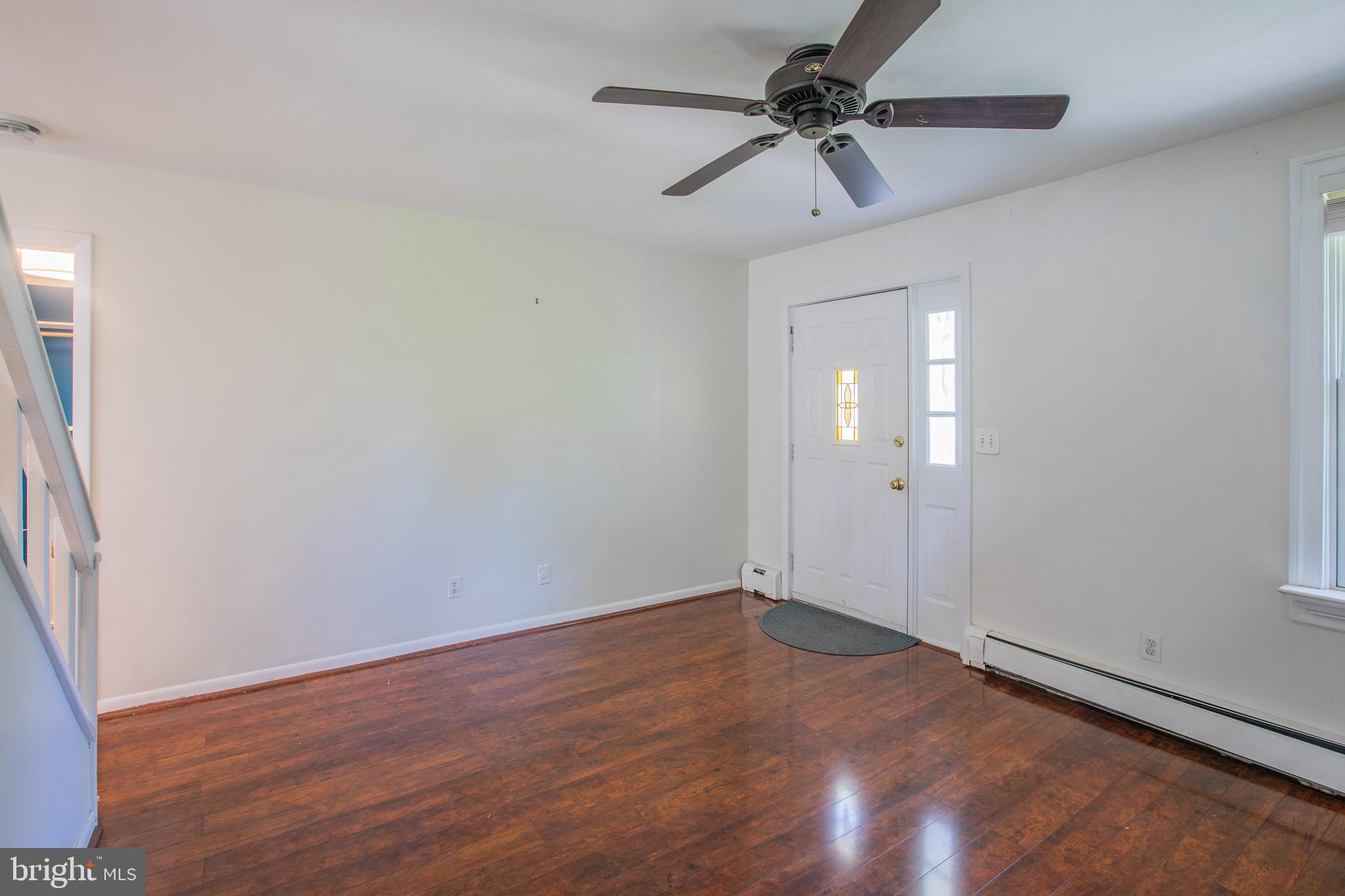 8875 Baltimore Street Savage, MD 20763 - Photo 4 of 32 wooden floor in an empty room