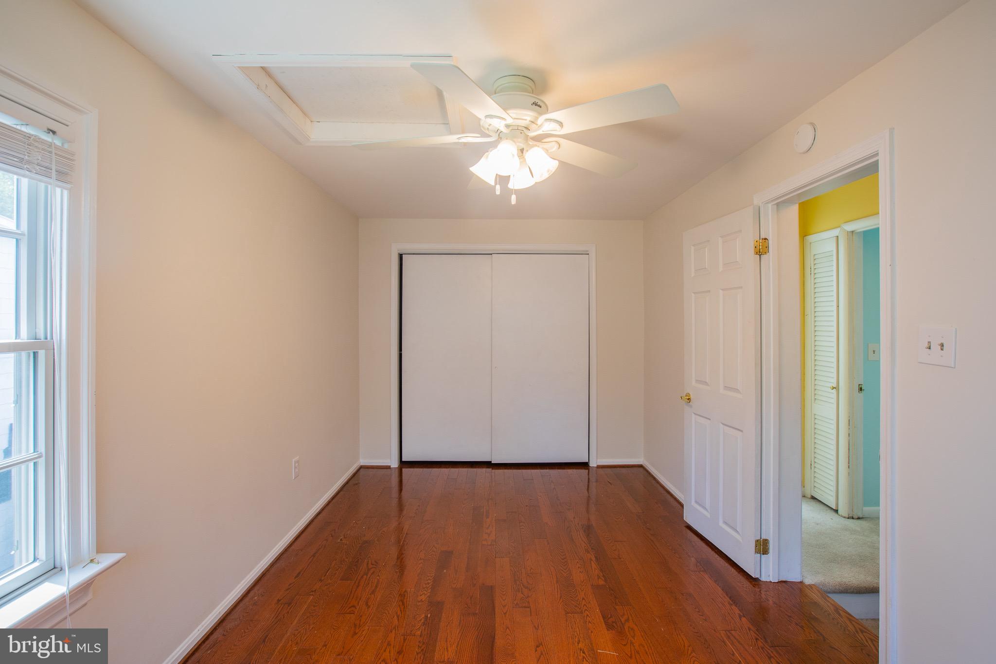 8875 Baltimore Street Savage, MD 20763 - Photo 9 of 32 a view of empty room with wooden floor