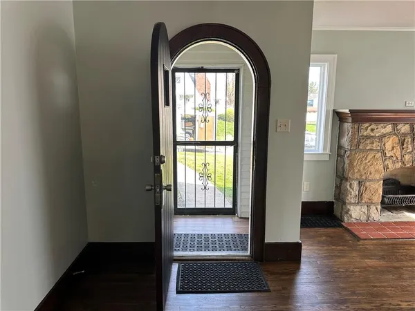 a view of front door with wooden floor