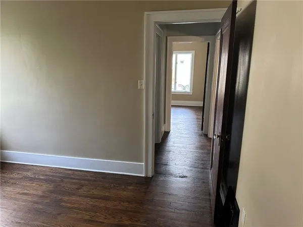 a view of a house with a yard and tree s