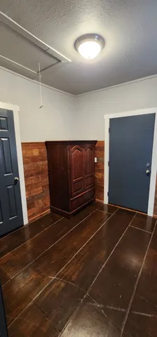 a room with walk in closet and bathroom