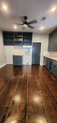a living room with walk in closet and window