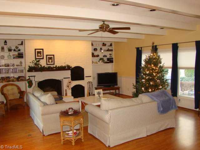 924 Redding Road Asheboro, NC 27203 - Photo 3 of 16 Den/Family/Great Room. New laminate flooring. Built-in shelving, exposed beam ceiling. Built-in grill and wood box.