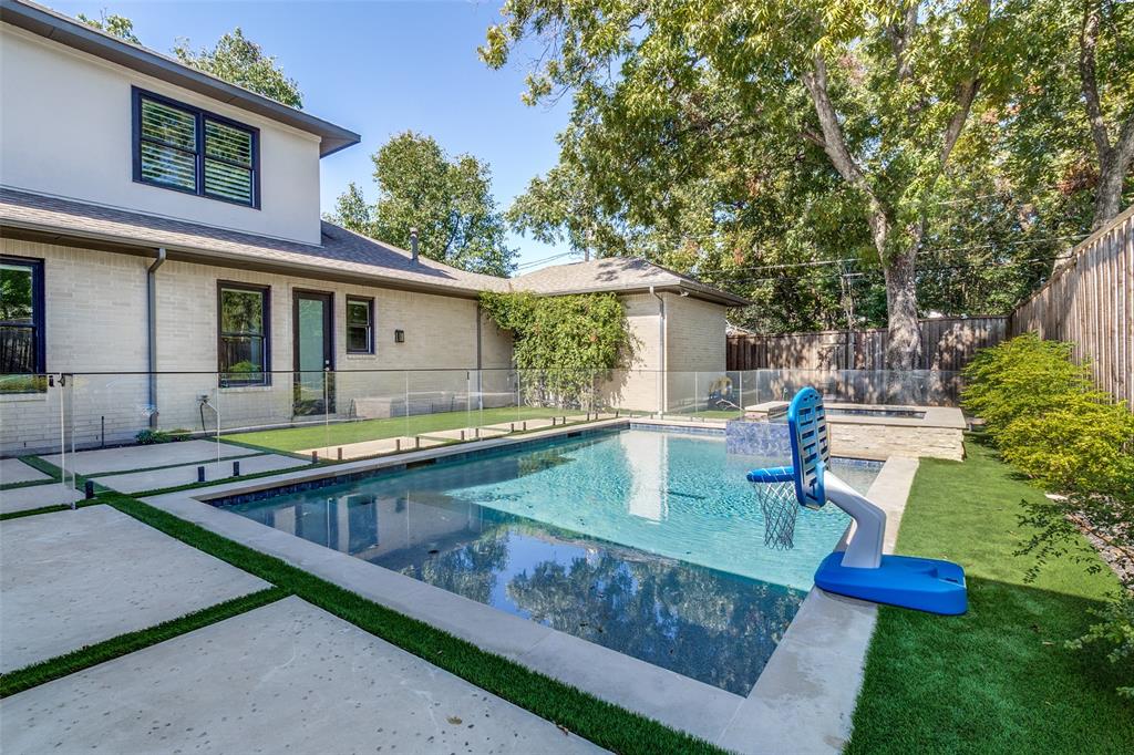 6615 Northwood Road Dallas, TX 75225 - Photo 27 of 30 a view of house with swimming pool outdoor seating