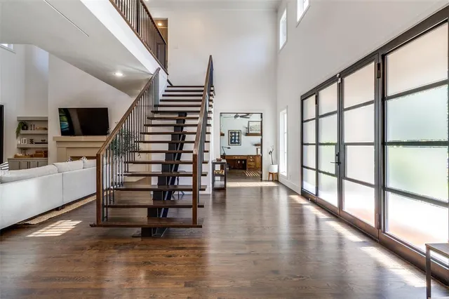 a view of entryway with wooden floor and stairs