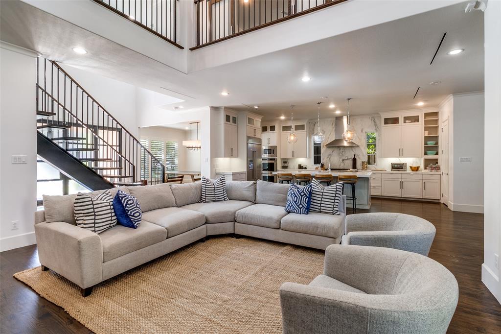 6615 Northwood Road Dallas, TX 75225 - Photo 6 of 30 a living room with furniture kitchen view and a wooden floor