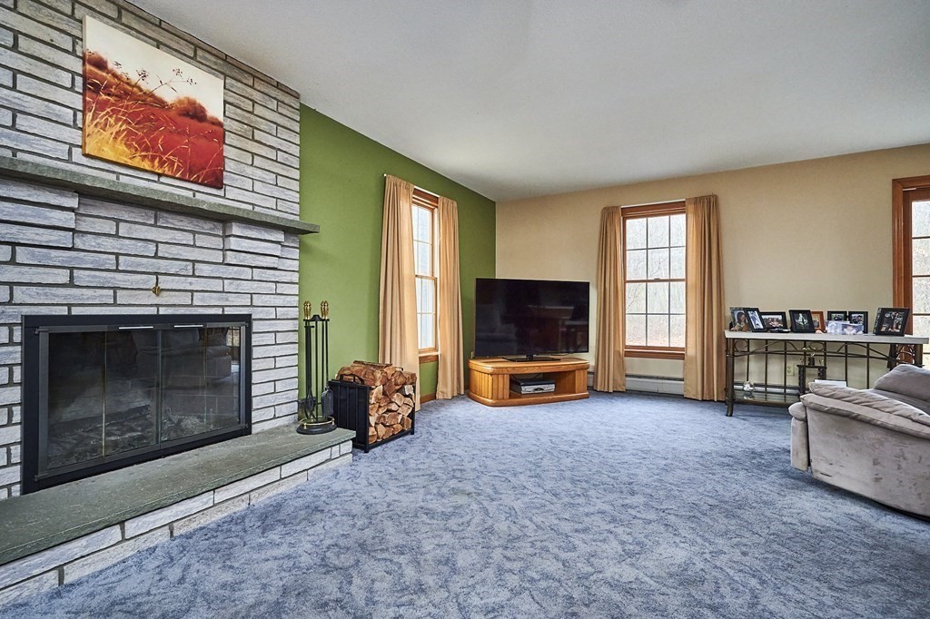 75 Pomeroy Meadow Road Southampton, MA 01073 - Photo 7 of 36 a living room with furniture and a flat screen tv