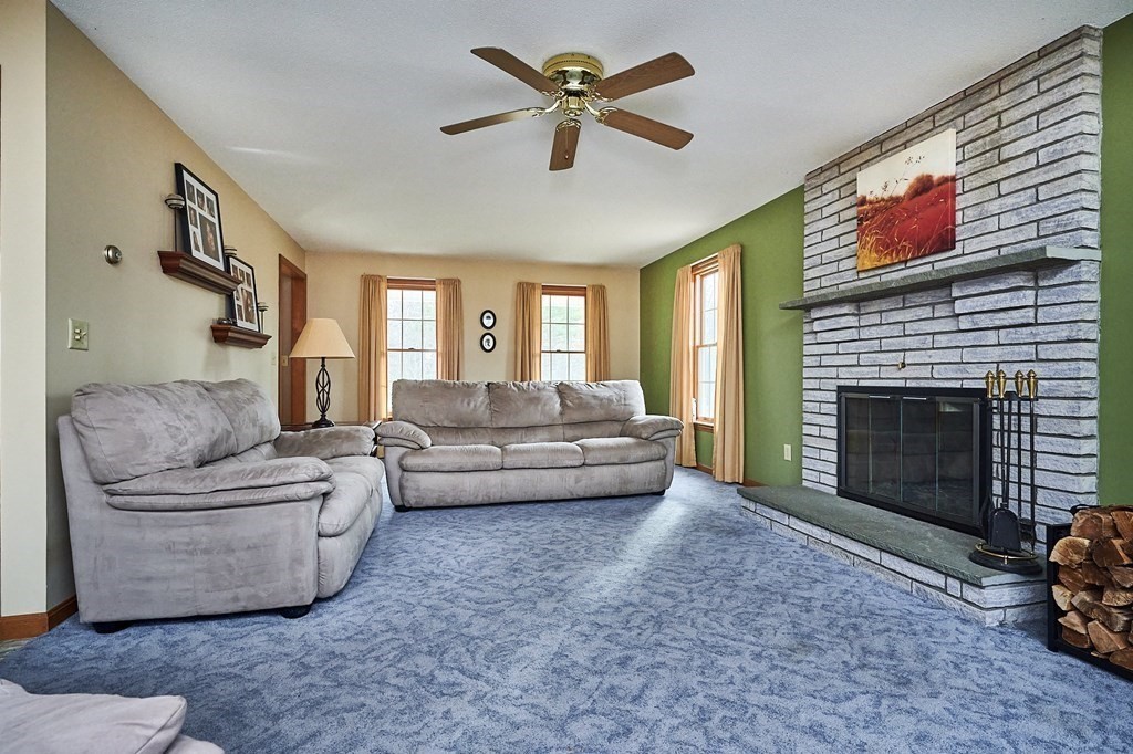 75 Pomeroy Meadow Road Southampton, MA 01073 - Photo 8 of 36 a living room with furniture and a fireplace