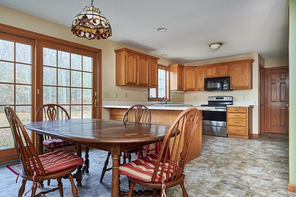 75 Pomeroy Meadow Road Southampton, MA 01073 - Photo 9 of 36 a view of a dining room with furniture window and wooden floor