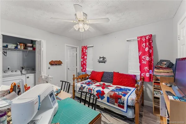 a bedroom with furniture and a chandelier