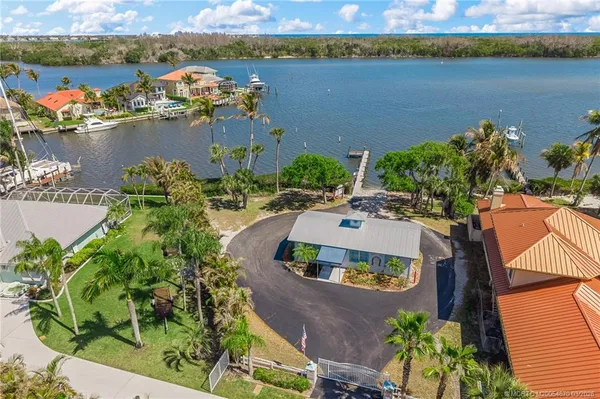 an aerial view of a house with a lake view