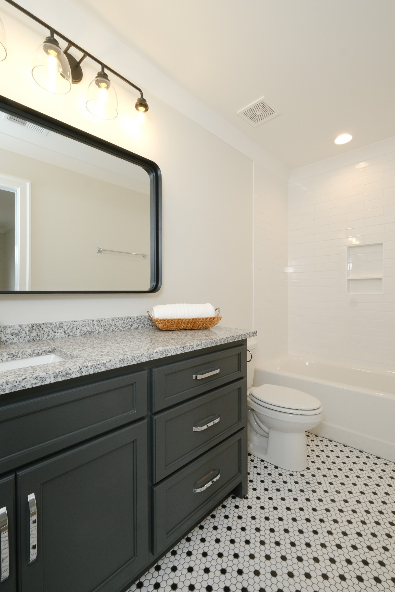 5740 Browns Mill Road Lascassas, TN 37085 - Photo 36 of 44 a bathroom with a granite countertop sink a toilet and a bathtub