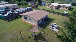 an aerial view of a house with a garden