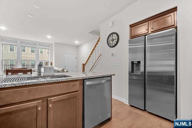 54 Arnold Drive Wood-Ridge, NJ 07075 - Photo 19 of 40 a kitchen with stainless steel appliances granite countertop a refrigerator and a sink