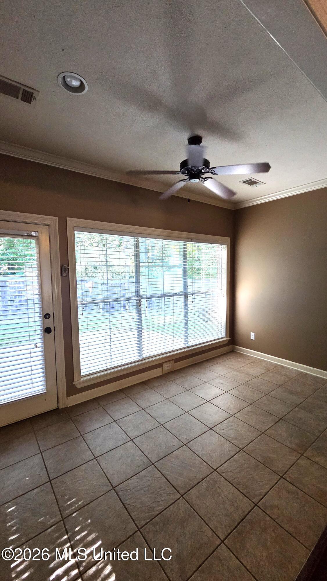 124 Cowles Creek Road Clinton, MS 39056 - Photo 17 of 42 SUNROOM OFF LIVING ROOM