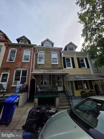 a front view of a house with yard