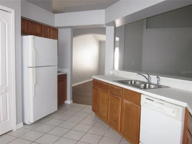 a bathroom with a double vanity sink and mirror