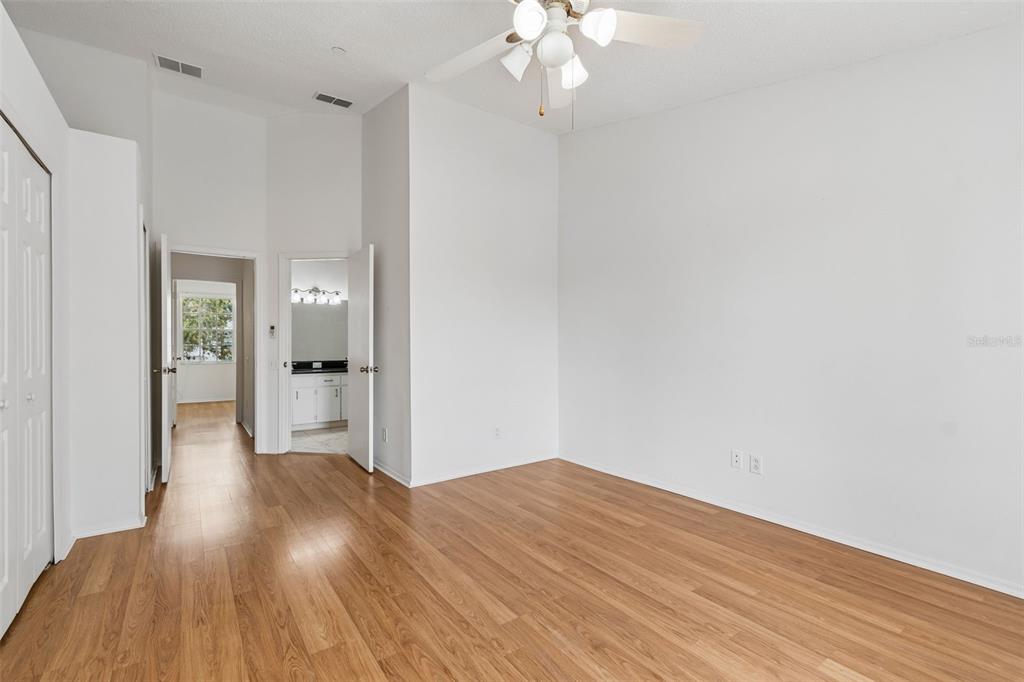 382 Countryside Key Boulevard Oldsmar, FL 34677 - Photo 38 of 58 wooden floor in an empty room with a window