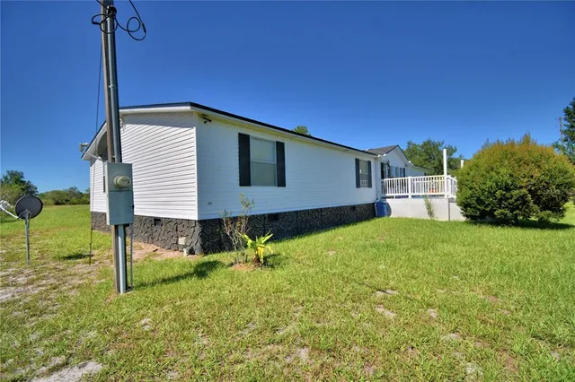 a house view with a backyard space