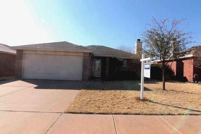 a front view of house with a yard