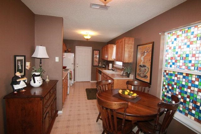2525 110th Street Lubbock, TX 79423 - Photo 6 of 10 a view of a dining room with furniture and chandelier