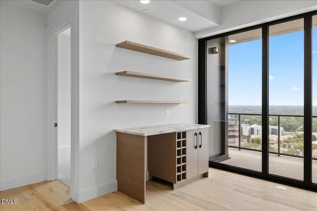a view of cabinets and wooden floor