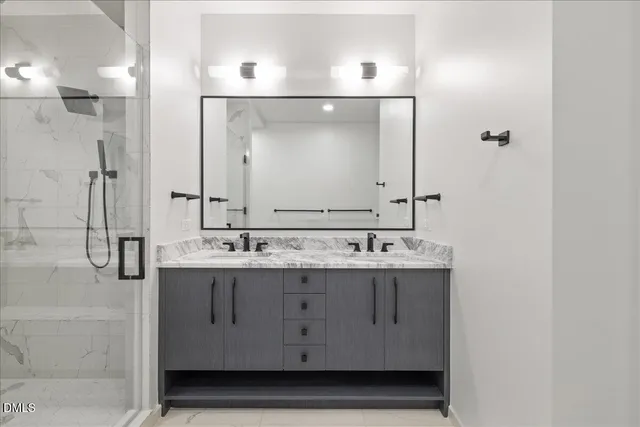 a bathroom with a sink and mirror
