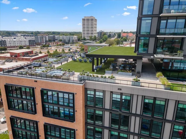 a large room with gym equipment and a view of living room